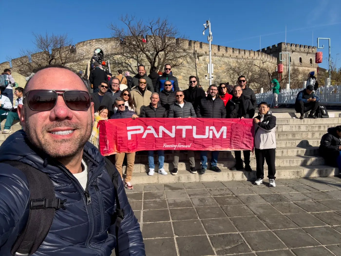 Group of Brazilian customers accompanied by Paulo Marques at the Great Wall near Beijing in 2024